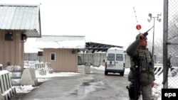 A U.S. soldier guards the main checkpoint at the Manas air base in Kyrgyzstan.
