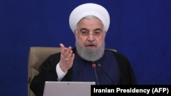 Then-Iranian President Hassan Rohani attends a ministerial council meeting in Tehran in May 2021.