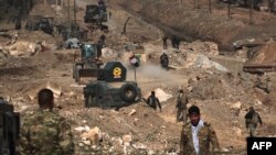 Iraqi forces advance as they enter Mosul airport on the southern edge of the city on February 23.