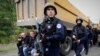 KOSOVO --- Kosovo police officers patrol by trucks where Kosovo Serbs block a road near the northern Kosovo border crossing of Jarinje, September 20, 2021