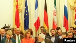 European Union High Representative for Foreign Affairs and Security Policy Federica Mogherini and Iran's Foreign Minister Mohammad Javad Zarif attend a meeting in Vienna, Austria July 6, 2018. REUTERS/Leonhard Foeger