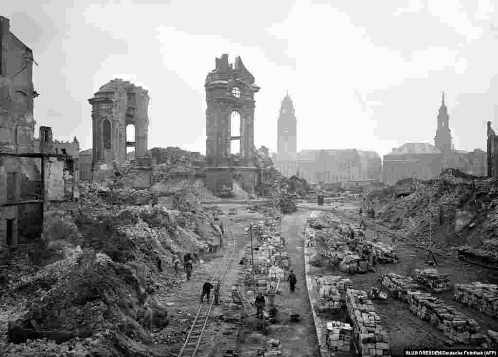 People clearing away rubble in 1952.