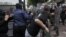 Protesters clash with riot police in Athens on October 9.