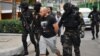  Sergei Medvedev (center) is shown being arrested by Thai special forces in Bangkok on February 9, 2018.