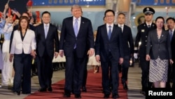 US President Donald Trump (center) arrives at Beijing airport on May 13.