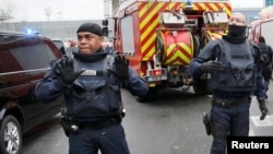 Police stand guard at Orly airport's southern terminal after the incident.