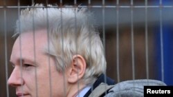 WikiLeaks founder Julian Assange arrives at Belmarsh Magistrates Court in southeast London on January 11.