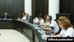 Armenia - Prime Minister Hovik Abrahamian (L) meets with representatives of Nairit plant workers demonstrating outside his office, Yerevan, 9Jun2015.