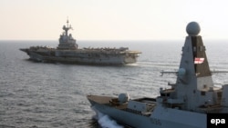 File - The British Royal Navy warship HMS Defender, or Daring-class air-defense destroyer, joins the French aircraft carrier, Charles de Gaulle, ready to support operations against Islamic State (IS) in the Indian Ocean, December 13, 2015