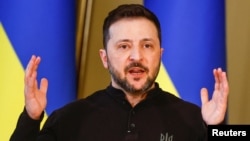 Ukrainian President Volodymyr Zelenskyy talks to reporters in Kyiv on March 12. 