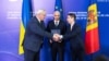 The foreign ministers of Moldova and Ukraine, along with the secretary-general of the Council of Europe, pose in Chisinau. (file photo)
