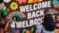 HEALTH-CORONAVIRUS/AUSTRALIA
People take photos in front of a 'Welcome Back' sign in Melbourne, October 28, 2020. 