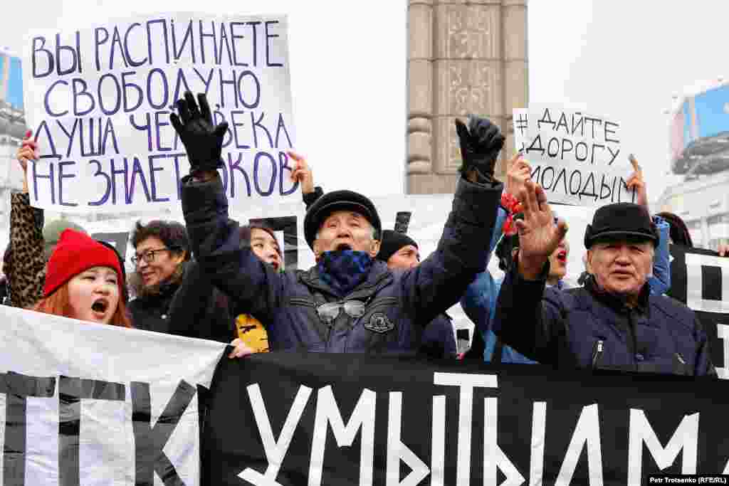 Protestors chant in front of Almaty&#39;s Independence Monument. Chants included, &quot;Kazakhstan Without Nazarbaev&quot; and, &quot;Old Man, Go Away!&quot;