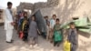 Afghan schoolchildren help set up their classroom on the outskirts of Jalalabad. (file photo)