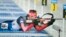 The biathlon combines cross-country skiing and rifle shooting.