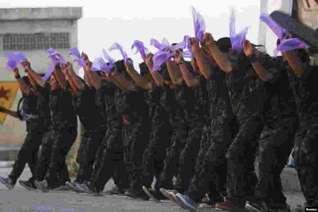 Kurdish female fighters of the Women&#39;s Protection Unit (YPJ) perform a folkloric dance at a military camp in the Syrian city of Ras al-Ain in Hasakah Province. (Reuters/Rodi Said)