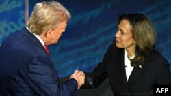 Kamala Harris (right) and Donald Trump shake hands before their fiery presidential debate in Philadelphia on September 10. 