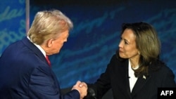 Kamala Harris (left) and Donald Trump shake hands before their fiery presidential debate in Philadelphia on September 10. 