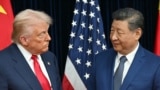 US President Donald Trump (L) and China's President Xi Jinping greet each other as they arrive for talks at the Gimhae Air Base, located next to the Gimhae International Airport in Busan on October 30, 2025.