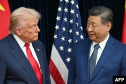 US President Donald Trump and Chinese President Xi Jinping arrive for talks in Busan, South Korea, on October 30, 2025.