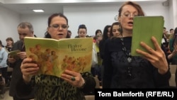 Jehovah’s Witnesses sings hymns during a service. in Russia in April 2017.