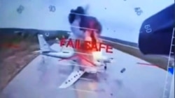A screenshot of video from Ukraine's SBU showing strikes on Russian strategic aviation aircraft at the Belaya airfield in the Irkutsk region bordering Mongolia on June 1.