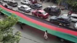 Deaths Reported As Afghans Unfurl Flags To Defy Taliban On Independence Day