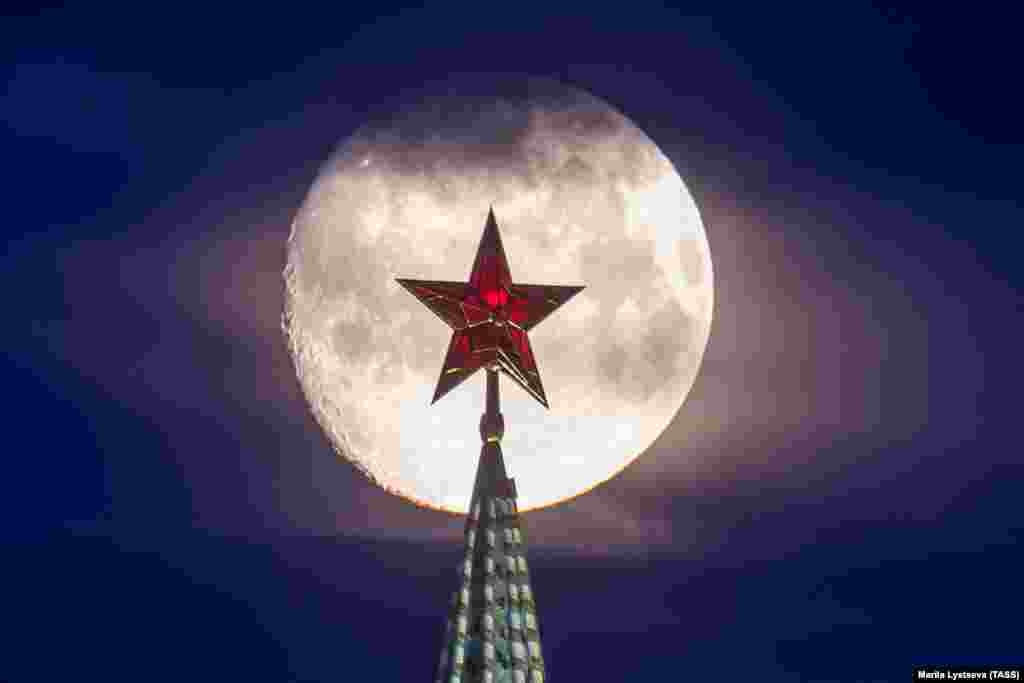 A full moon shines behind the Vodovzvodnaya Tower of the Kremlin in Moscow. (TASS/Marina Lystseva)