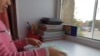 На подоконнике в комнате общежития Вероника, девочка из Уральска, которой предстоит пойти в первый класс, хранит всё, что у нее есть для учёбы, — тетради, карандаши, выданные школой учебники.