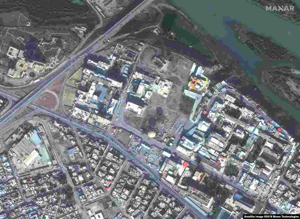 These satellite images show a hospital and hotel in Mosul, Iraq on November 13, 2015, before Islamic State (IS) militants invaded the city and then the same area on July 8, 2017, after IS destroyed much of this part of the city. U.S.-led coalition forces battled the militants, liberating IS-held territory by March 2019.&nbsp;