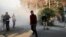 Students take part in a demonstration inside Tehran University on December 30. The recent wave of protests in Iran was initially fueled by economic grievances and mostly young citizens frustrated by an ailing economy and bleak prospects.
