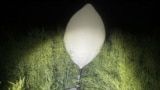 Balloons like this one, in a file photo shared by Lithuanian border guards, have been used to smuggle contraband from Belarus.