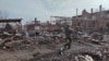 This grab taken from a handout footage released by the Russian Defence Ministry on March 13, 2025, shows destructions in the town of Sudzha in the Kursk region.