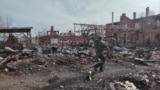 This grab taken from a handout footage released by the Russian Defence Ministry on March 13, 2025, shows destructions in the town of Sudzha in the Kursk region.