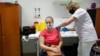 A nurse administers the Russian Sputnik V vaccine to a patient in Nagykanizsa on April 13.