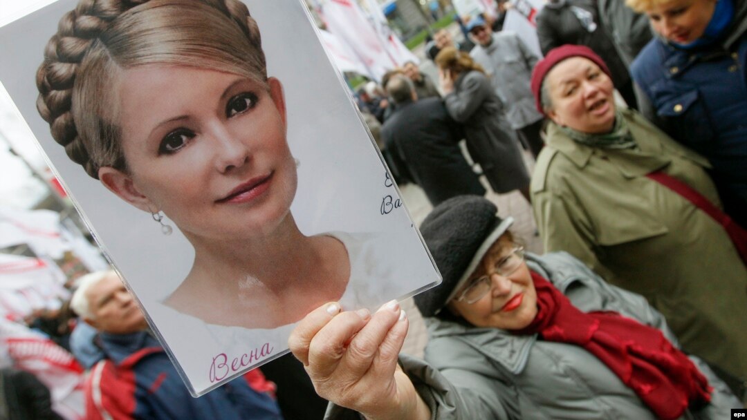 A Ukrainian opposition supporter holds aloft a portrait of jailed ex-Prime Minister Yulia Tymoshenko during a protest in Kyiv last month.