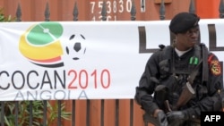 A Congolese policeman stands guard outside players' quarters in Cabinda.