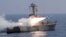 A handout picture provided by Iran's military shows a Nasr missile being fired from a navy warship during a military exercise.
