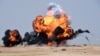 Smoke and fire billows following an aerial bombardment during the Northern Thunder military exercises in Hafr al-Batin, 500 kilometres north-east of the Saudi Capital Riyadh on March 10.