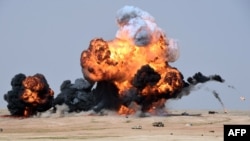 Smoke and fire billows following an aerial bombardment during the Northern Thunder military exercises in Hafr al-Batin, 500 kilometers north-east of the Saudi Capital Riyadh on March 10.