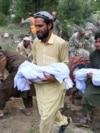 Afghans carry the deceased for funeral ceremony after earthquakes at Mazar Dara village in Nurgal district, Kunar province, in Eastern Afghanistan, on September 1, 2025.