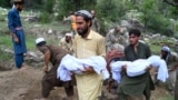 Afghans carry the deceased for funeral ceremony after earthquakes at Mazar Dara village in Nurgal district, Kunar province, in Eastern Afghanistan, on September 1, 2025.