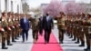 U.S. Defense Secretary Lloyd Austin (center) walks past a guard of honor during his visit to Kabul on March 21. 