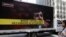 A truck displaying posters protesting against Iranian President Mahmud Ahmadinejad near the UN building in New York in September 2009 