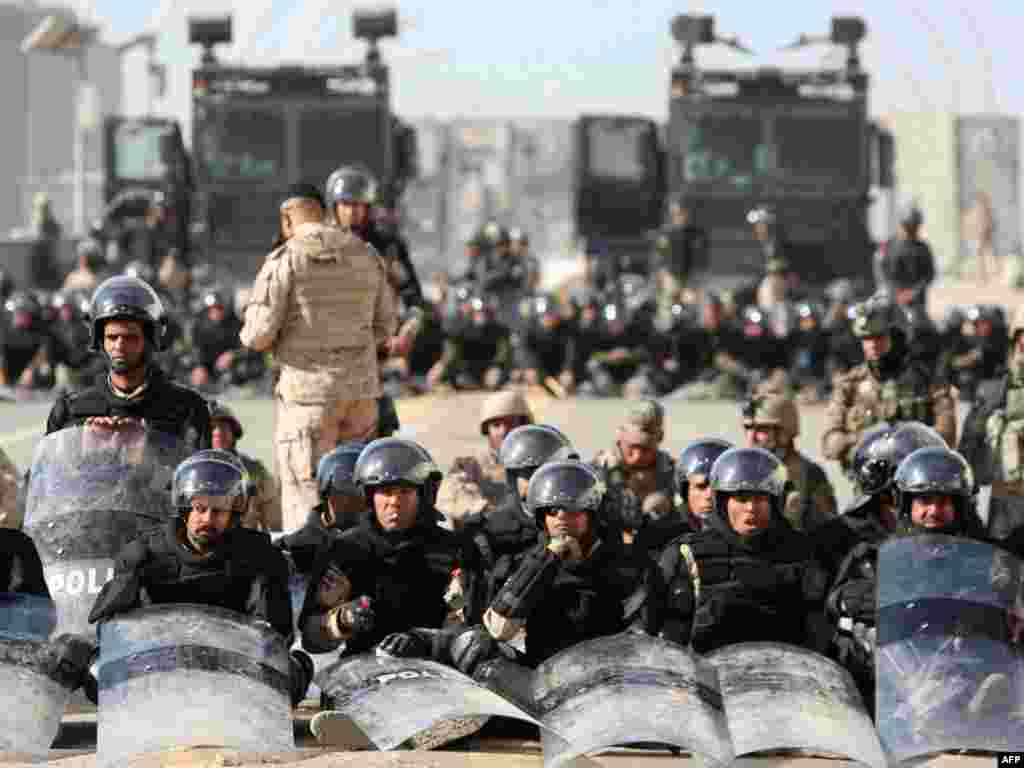 Iraqi riot police block streets in the capital, Baghdad, during another "Day of Rage" on March 4. Photo by Ahmad al-Rubaye for Reuters