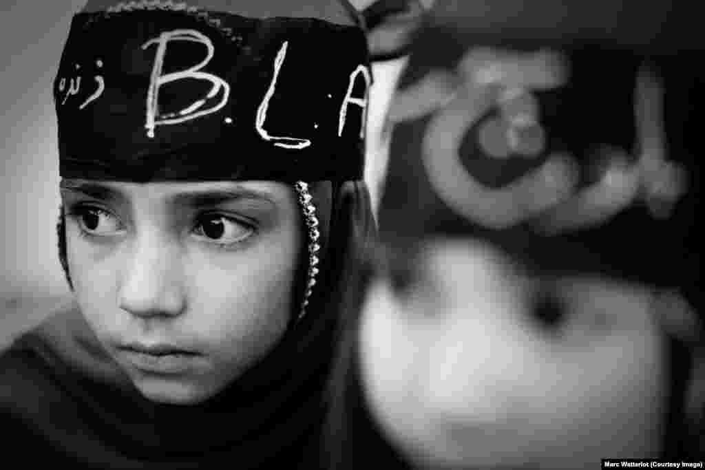A girl in Quetta wears a bandana supporting the Baloch Liberation Army, a nationalist militant group.