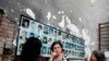 People mourn inside School Number One during a ceremony commemorating the victims of the 2004 hostage crisis in the southern Russian town of Beslan, September 1, 2014.