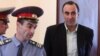 Armenia - Tigran Postanjian is brought into courtroom to stand trial on controversial corruption charges.