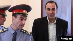 Armenia - Tigran Postanjian is brought into courtroom to stand trial on controversial corruption charges.