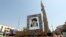 A Shahab-3 surface-to-surface missile, which is said to be capable of delivering a long-range nuclear warhead, is displayed next to a portrait of Iranian Supreme Leader Ayatollah Ali Khamenei at a street exhibition in Tehran earlier this year. 